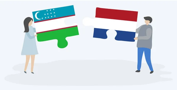 Casal Segurando Duas Peças Quebra Cabeças Com Bandeiras Uzbeques Holandesas — Vetor de Stock