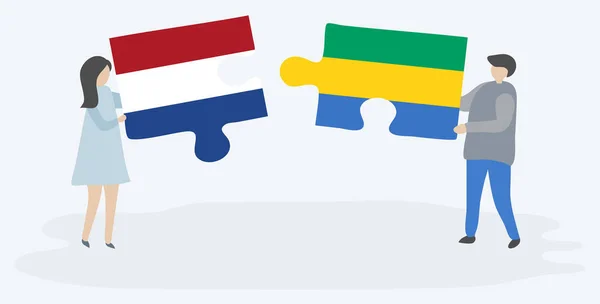 Paar Houden Twee Puzzels Stukken Met Nederlandse Gabonese Vlaggen Nederland — Stockvector