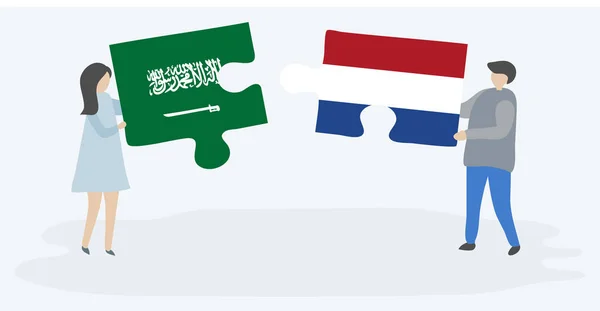 Paar Mit Zwei Puzzleteilen Mit Saudi Arabischen Und Holländischen Flaggen — Stockvektor