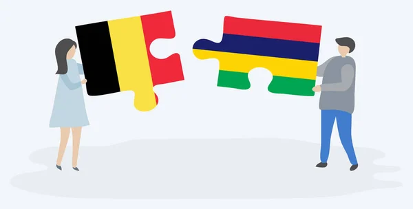 Ζευγάρι Που Κρατά Δύο Κομμάτια Παζλ Βελγικές Και Μαυρικίου Σημαίες — Διανυσματικό Αρχείο
