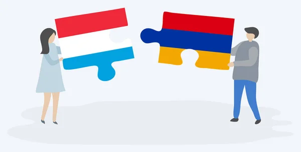 一对夫妇拿着两块拼图 上面挂着卢森堡和亚美尼亚国旗 卢森堡和亚美尼亚国家符号在一起 — 图库矢量图片