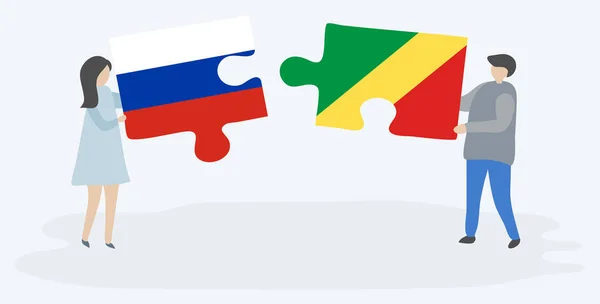 Ζευγάρι Που Κρατά Δύο Κομμάτια Παζλ Ρωσικά Και Κονγκό Σημαίες — Διανυσματικό Αρχείο