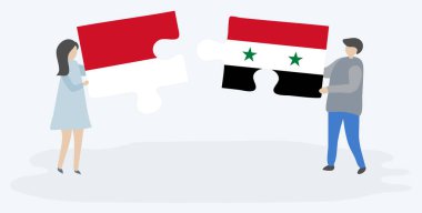 Endonezya ve Suriye bayrakları ile iki bulmaca parçaları tutan çift. Endonezya ve Suriye ulusal sembolleri birlikte.