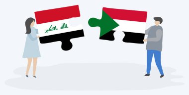 Irak ve Sudan bayraklarıyla iki bulmaca tutan çift. Irak ve Sudan ulusal sembolleri birlikte.