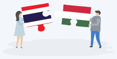 Çift Tay ve Macar bayrakları ile iki bulmaca parçaları tutan. Tayland ve Macaristan ulusal sembolleri birlikte.