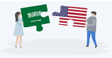 Suudi Arabistan ve Amerikan bayrakları ile iki bulmaca parçaları tutan çift. Suudi Arabistan ve Amerika Birleşik Devletleri ulusal sembolleri birlikte.