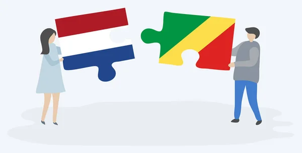 Ζευγάρι Που Κρατά Δύο Κομμάτια Παζλ Ολλανδικές Και Κογκολέζικες Σημαίες — Διανυσματικό Αρχείο