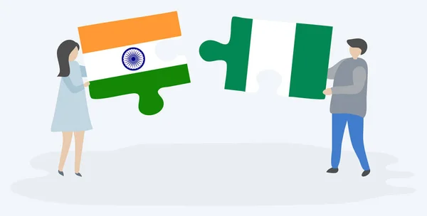 インドとナイジェリアの旗を持つ2つのパズルのピースを保持しているカップル インドとナイジェリアのシンボル — ストックベクタ