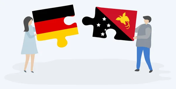 Пара Держащая Две Головоломки Немецкими Папуасскими Флагами Германия Папуа Новая — стоковый вектор