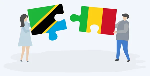 Pareja Sosteniendo Dos Piezas Rompecabezas Con Banderas Tanzania Malí Tanzania — Archivo Imágenes Vectoriales