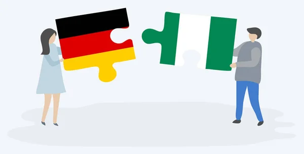 Paar Houden Twee Puzzels Stukken Met Duitse Nigeriaanse Vlaggen Duitsland — Stockvector