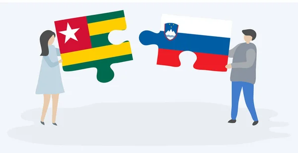 Couple Tenant Deux Pièces Puzzles Avec Des Drapeaux Togolais Slovènes — Image vectorielle