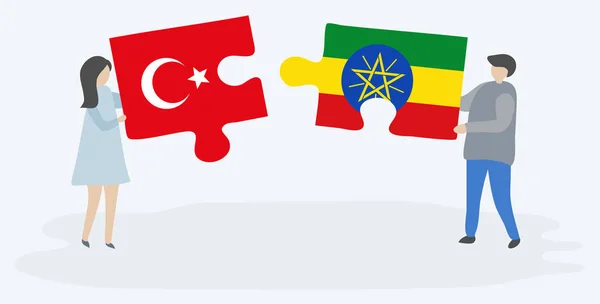 Casal Segurando Duas Peças Quebra Cabeças Com Bandeiras Turcas Etíopes —  Vetores de Stock