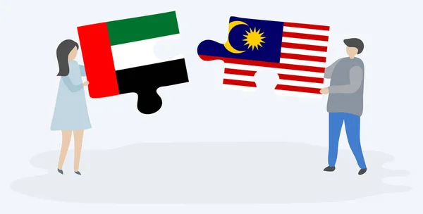 Paar Mit Zwei Puzzleteilen Mit Emirischen Und Malaysischen Flaggen Vereinte — Stockvektor