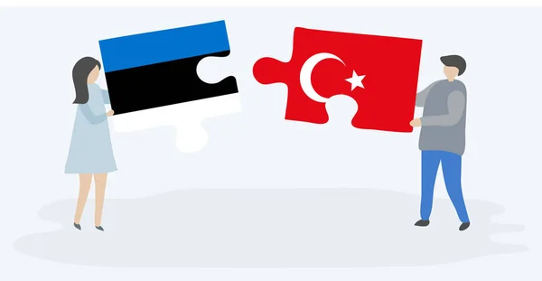 Estonya Türk Bayrakları Ile Iki Bulmaca Parçaları Tutan Çift Estonya — Stok Vektör