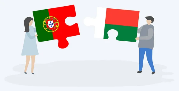 Couple Holding Two Puzzles Pieces Portuguese Malagasy Flags Portugal Madagascar — Stock Vector