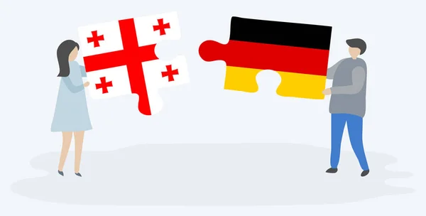 Couple Tenant Deux Pièces Puzzles Avec Des Drapeaux Géorgien Allemand — Image vectorielle