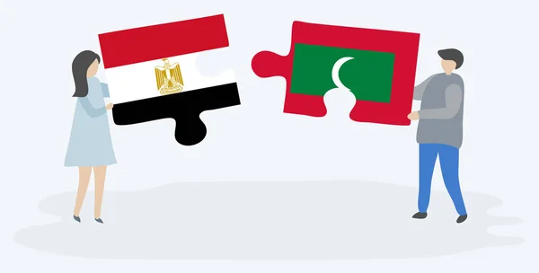 Dvojice Egyptskými Maldivijskými Vlajkami Drží Dvě Skládanky Národní Symboly Egypta — Stockový vektor