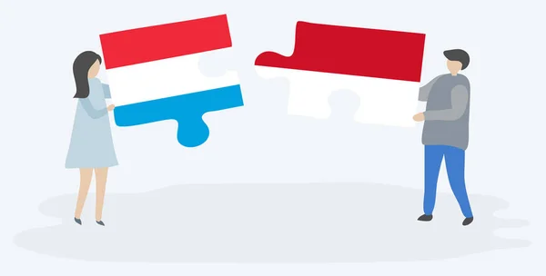 Para Trzyma Dwa Kawałki Puzzli Luksemburskie Monako Flagi Luksemburg Monako — Wektor stockowy