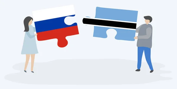 Pareja Sosteniendo Dos Piezas Rompecabezas Con Banderas Rusas Motswanas Rusia — Archivo Imágenes Vectoriales