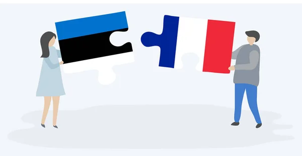 Dvojice Která Drží Dvě Skládanky Estonskými Francouzskými Vlajkami Společné Národní — Stockový vektor