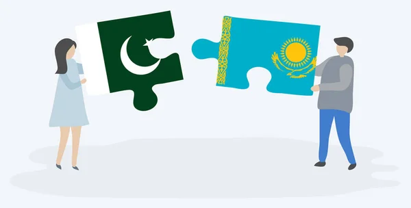 Couple Holding Two Puzzles Pieces Pakistani Kazakh Flags Pakistan Kazakhstan — Stock Vector