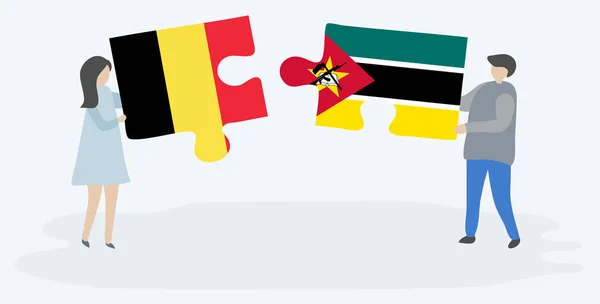 Dvojice Která Drží Dvě Skládanky Belgickými Mosambické Vlajky Národní Symboly — Stockový vektor