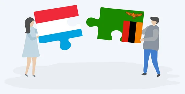 Casal Segurando Duas Peças Quebra Cabeças Com Bandeiras Luxemburguesas Zambianas — Vetor de Stock