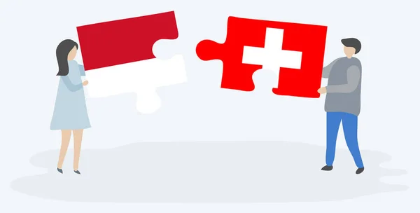 Para Trzyma Dwa Kawałki Puzzli Indonezyjskimi Szwajcarskich Flag Symbole Narodowe — Wektor stockowy