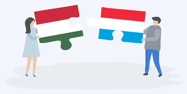 Casal Segurando Duas Peças Quebra Cabeças Com Bandeiras Húngaras Luxemburguesas — Vetor de Stock