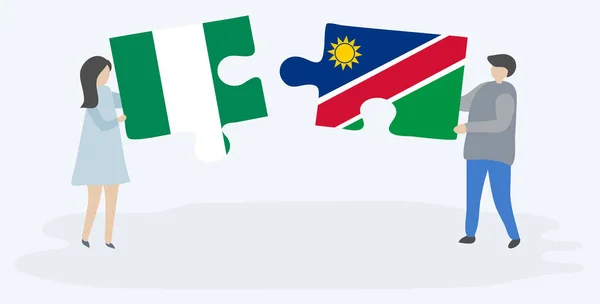 Pareja Sosteniendo Dos Piezas Rompecabezas Con Banderas Nigeria Namibia Nigeria — Vector de stock