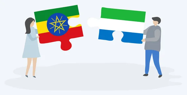 Casal Segurando Duas Peças Quebra Cabeças Com Bandeiras Etíopes Serra —  Vetores de Stock
