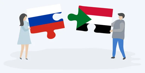 Couple Tenant Deux Pièces Puzzles Avec Des Drapeaux Russes Soudanais — Image vectorielle