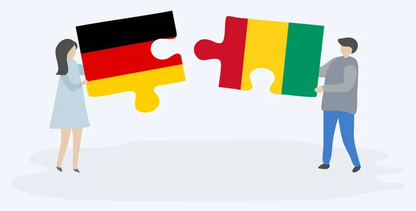 Couple Tenant Deux Pièces Puzzles Avec Des Drapeaux Allemands Guinéens — Image vectorielle