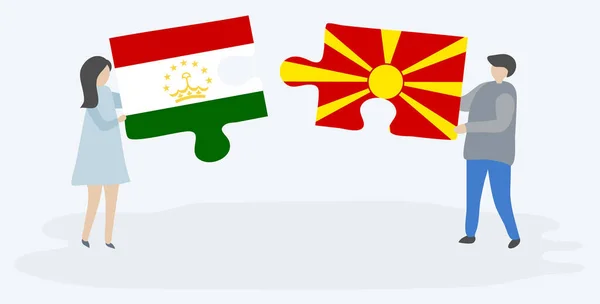 Para Trzyma Dwa Kawałki Puzzli Tajikistani Macedoński Flagi Tadżykistan Macedonia — Wektor stockowy