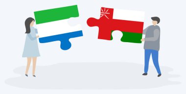 Sierra Leone ve Umman bayrakları ile iki bulmaca parçaları tutan çift. Sierra Leone ve Umman ulusal sembolleri birlikte.