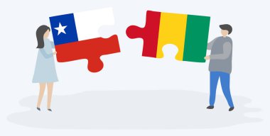 Şili ve Gine bayrakları ile iki bulmaca parçaları tutan çift. Şili ve Gine ulusal sembolleri birlikte.