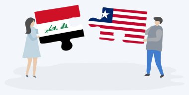 Irak ve Liberya bayrakları ile iki bulmaca parçaları tutan çift. Irak ve Liberya ulusal sembolleri birlikte.