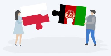 Polonya ve Afgan bayrakları ile iki bulmaca parçaları tutan çift. Polonya ve Afganistan ulusal sembolleri birlikte.