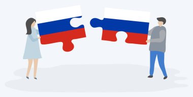 Rus ve Rus bayrakları ile iki bulmaca parçaları tutan çift. Rusya ve Rusya ulusal sembolleri birlikte.