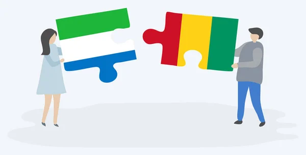 Sierra Leone Gine Bayrakları Ile Iki Bulmaca Parçaları Tutan Çift — Stok Vektör