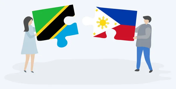 Пара Держащая Две Головоломки Танзанийскими Филиппинскими Флагами Государственные Символы Танзании — стоковый вектор