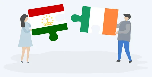Couple Tenant Deux Pièces Puzzles Avec Des Drapeaux Tadjiks Irlandais — Image vectorielle