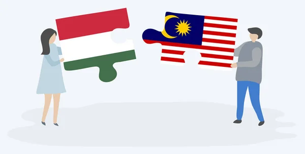 Paar Houden Twee Puzzels Stukken Met Hongaarse Maleisische Vlaggen Hongarije — Stockvector