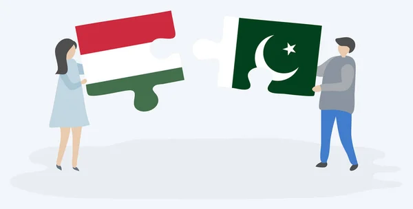 Casal Segurando Duas Peças Quebra Cabeças Com Bandeiras Húngaras Paquistanesas — Vetor de Stock