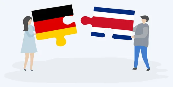 Casal Segurando Duas Peças Quebra Cabeças Com Bandeiras Alemãs Costa — Vetor de Stock