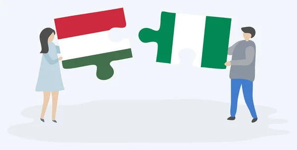 Paar Houden Twee Puzzels Stukken Met Hongaarse Nigeriaanse Vlaggen Hongarije — Stockvector
