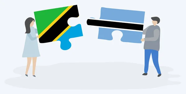 Couple Holding Two Puzzles Pieces Tanzanian Motswana Flags Tanzania Botswana — Stock Vector