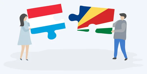 Casal Segurando Dois Quebra Cabeças Peças Com Bandeiras Luxemburguesas Seychellois —  Vetores de Stock
