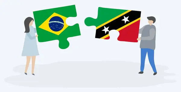 Couple Tenant Deux Pièces Puzzles Avec Des Drapeaux Brésiliens Kittitiens — Image vectorielle